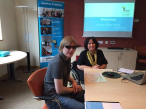 David and Madissa sitting at the table, getting ready to start the event.