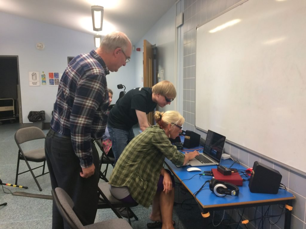 Included is a picture of 2 participants working with David on the laptop and keyboard, whilst another participant is watching and listening to the discussion.