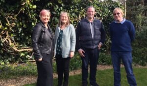 Included in the photo from left to right are Rachel Goodall, Janice Mason, Billy Stevenson, and David Shervill. They are all smiling  at the camera, with hedgerow behind them.